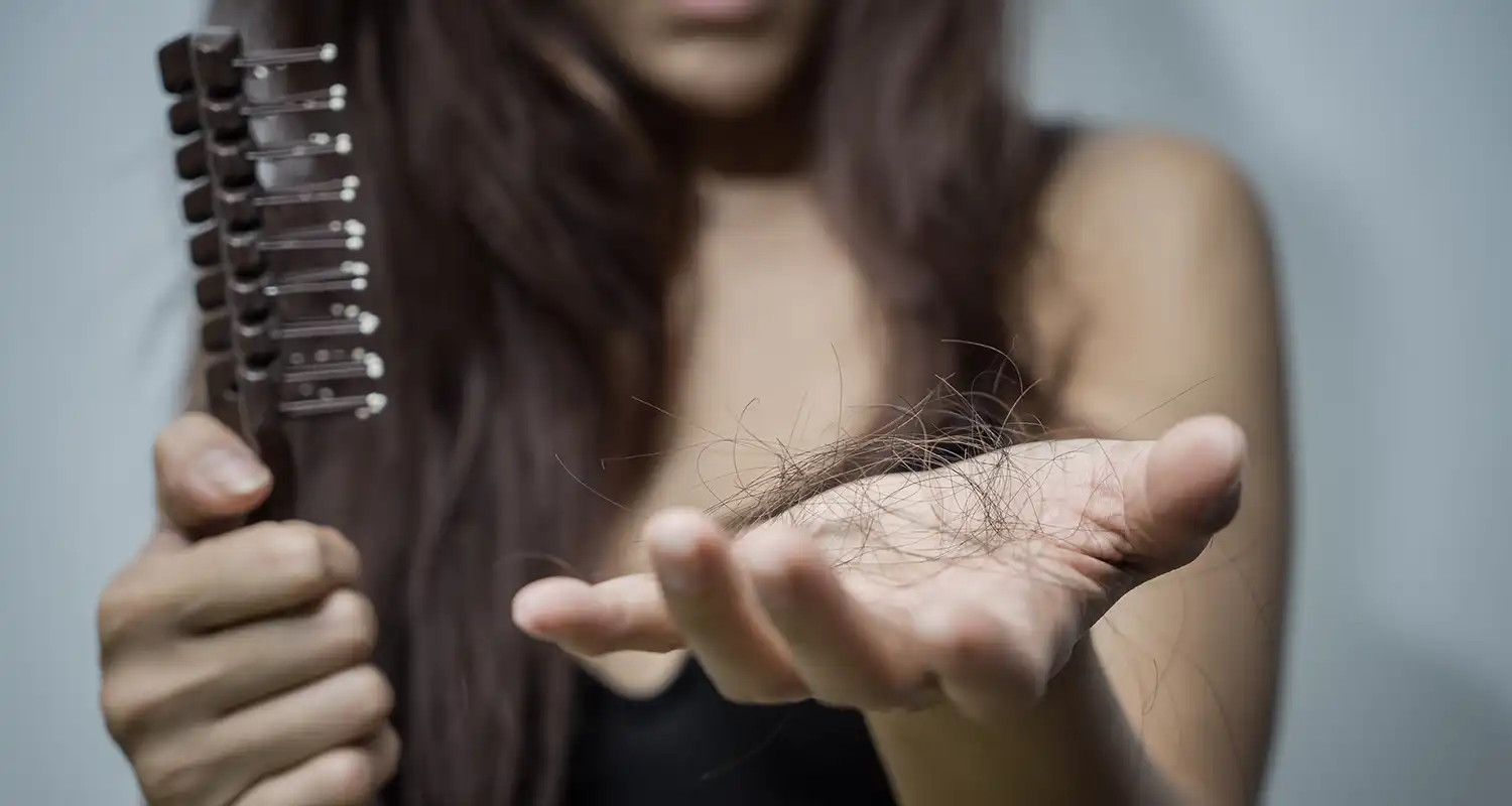 Frustrated female with hair in hand